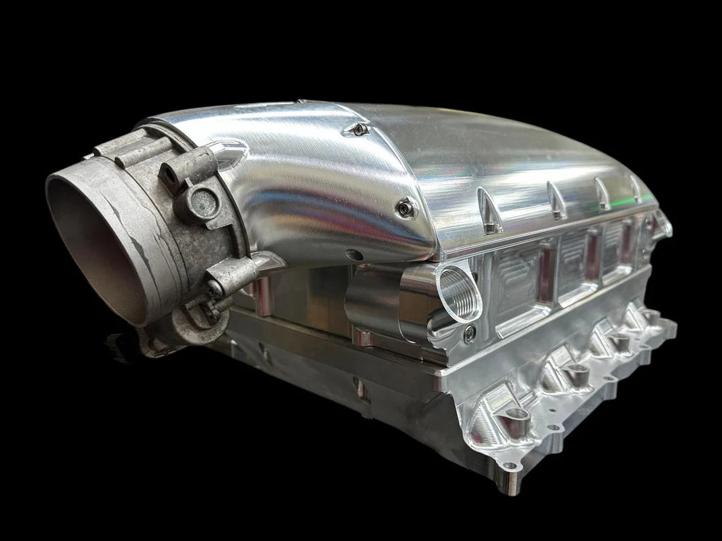 Metallic engine block on a black background