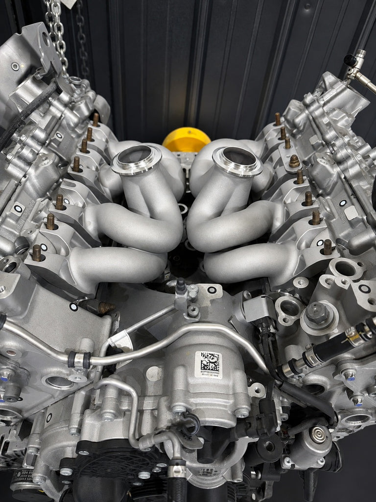 ModalWorks equal-length M177 exhaust manifolds installed in the hot-vee of an AMG 4.0L V8, V-band turbo flanges up