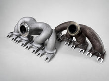 Load image into Gallery viewer, ModalWorks equal-length M177 exhaust manifold next to the factory cast manifold — crossing equal-length runners vs unequal cast paths
